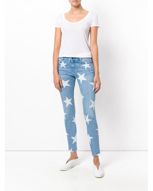 Stella Mccartney Skinny Star Printed Denim Jeans In Blue Save 6 Lyst
