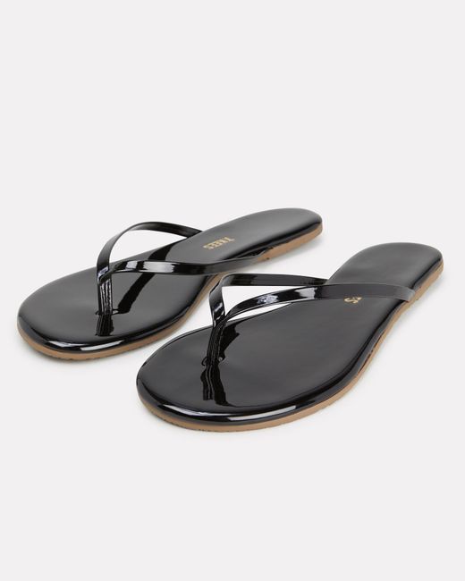 black shiny flip flops
