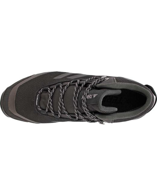 lyst adidas terrex tivid metà cp scarpa in nero per gli uomini. lyst adidas terrex tivid metà cp scarpa in nero per gli uomini.