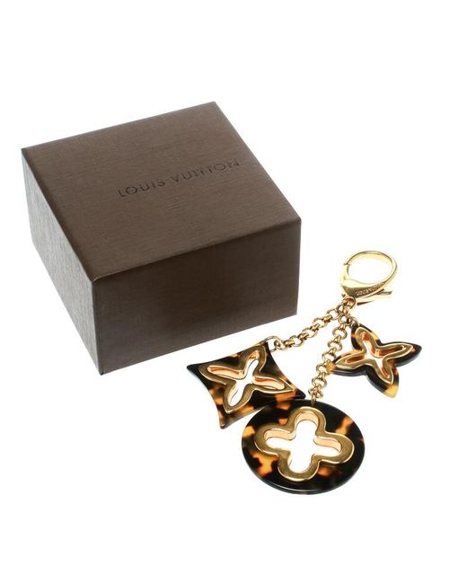 Lyst - Louis Vuitton Insolence Brown Resin Gold Tone Bag Charm in Metallic