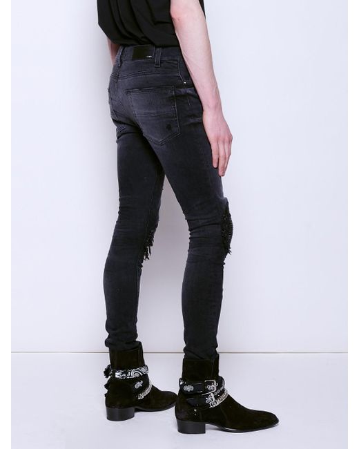 amiri black patch jeans