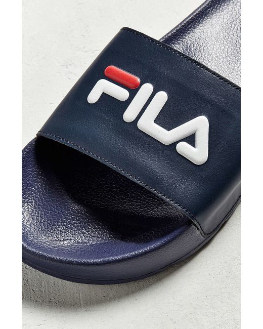 white fila slides