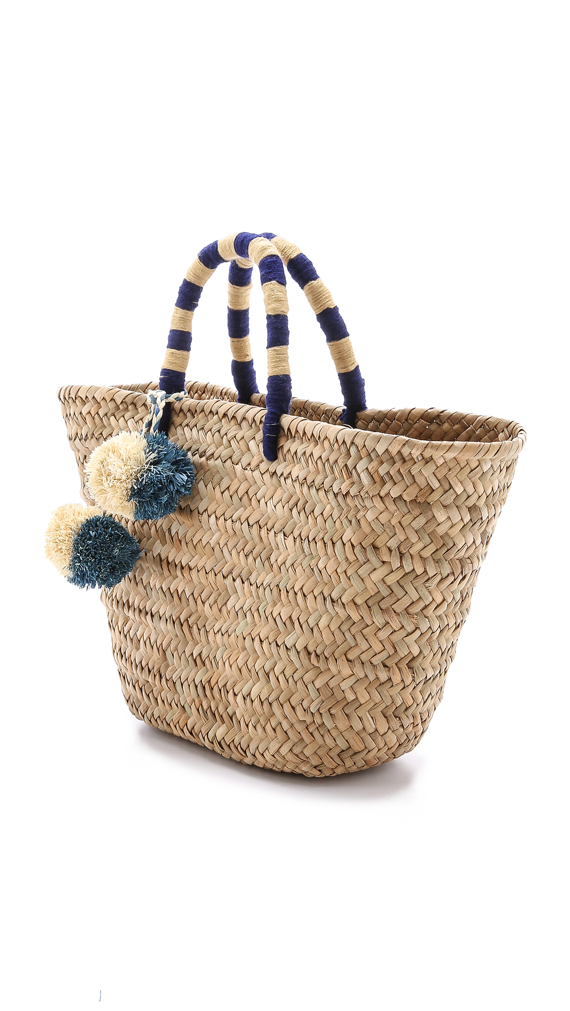 woven bag with pom poms