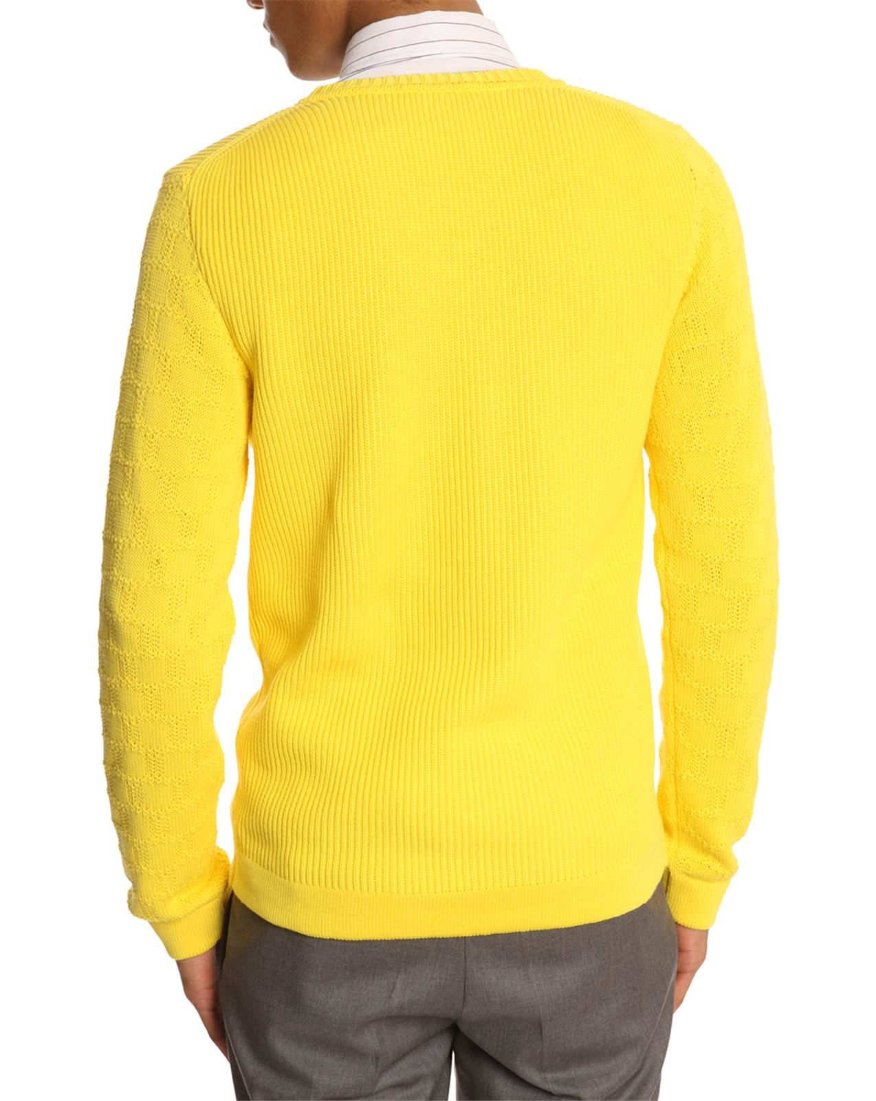 in the yellow sweater sweater and boots in the yellow sweater sweater and boots