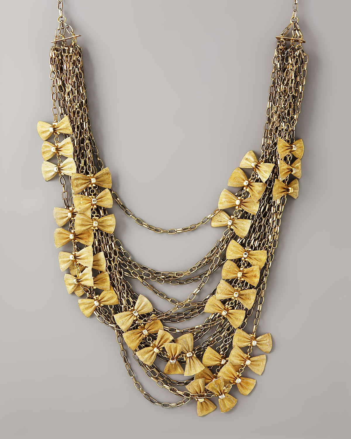 Lyst Oscar de la renta Multichain Bow Necklace in Metallic