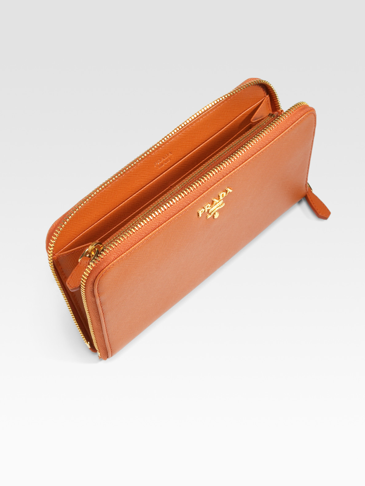 Prada Saffiano Metal Oro Side Zipper Wallet in Brown (caramel) | Lyst