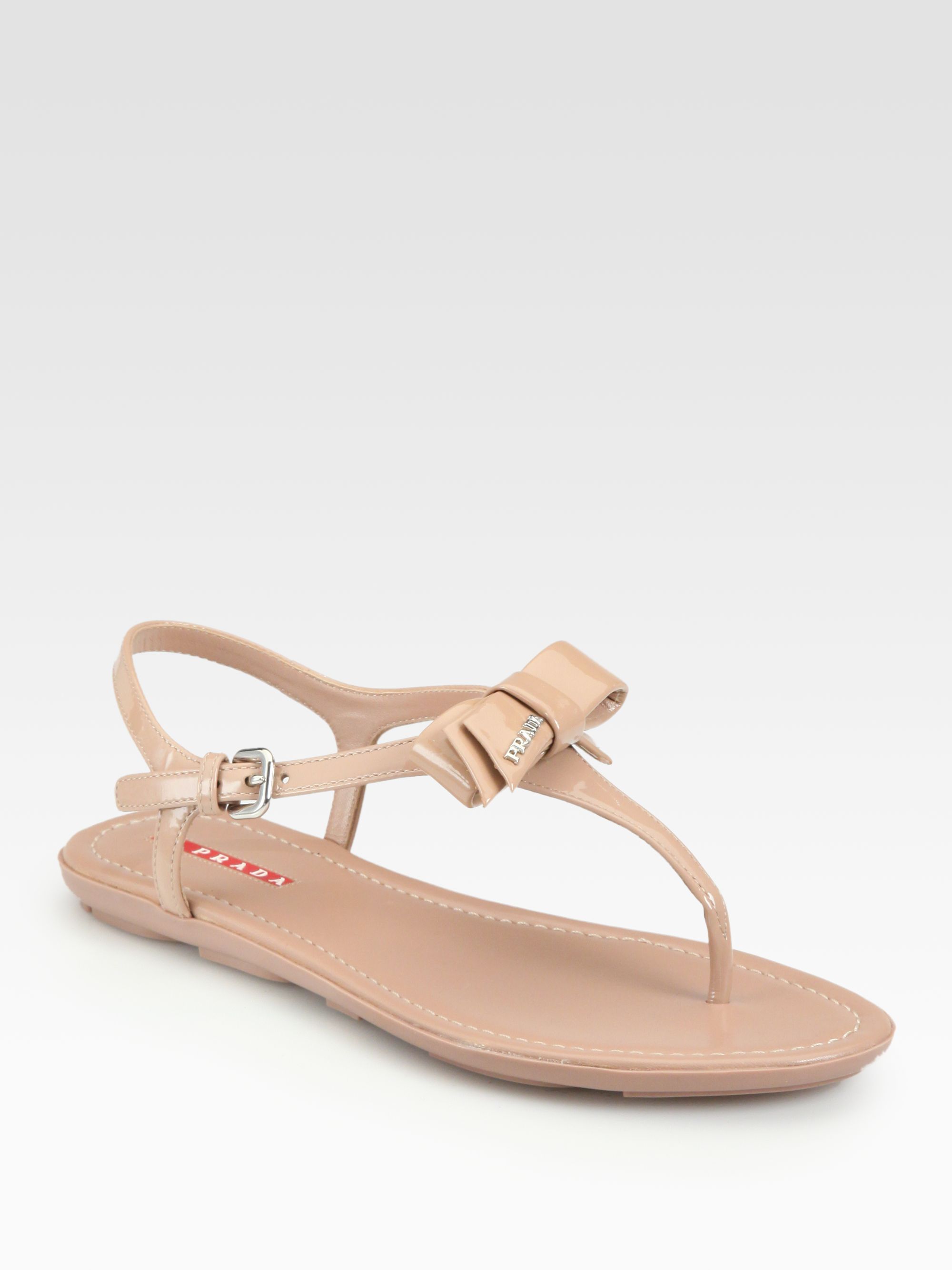 Prada Patent Leather Bow Thong Sandals in Beige (nude) | Lyst  