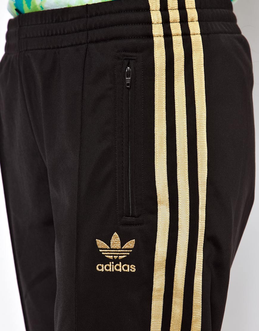 black and gold track pants