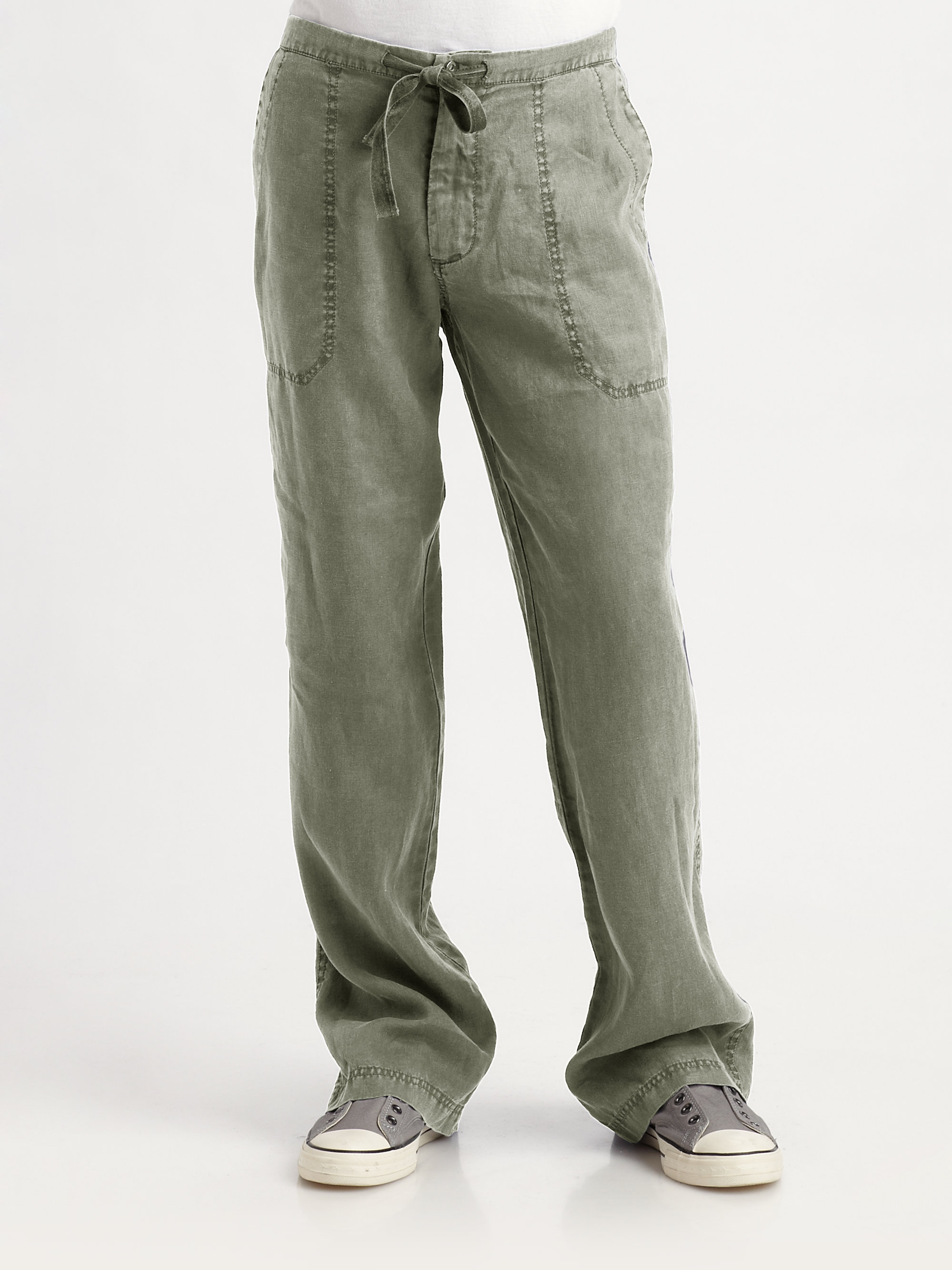 person wearing green drawstring linen pants with side pockets