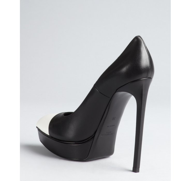 black pumps with white cap toe