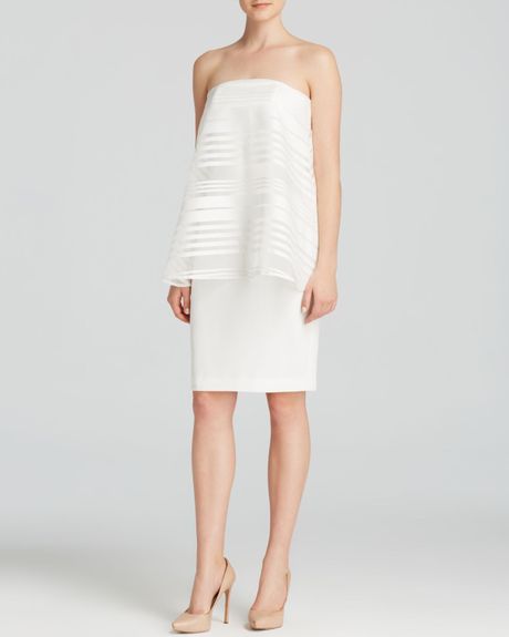 Juniors long white sheath dress with overlay