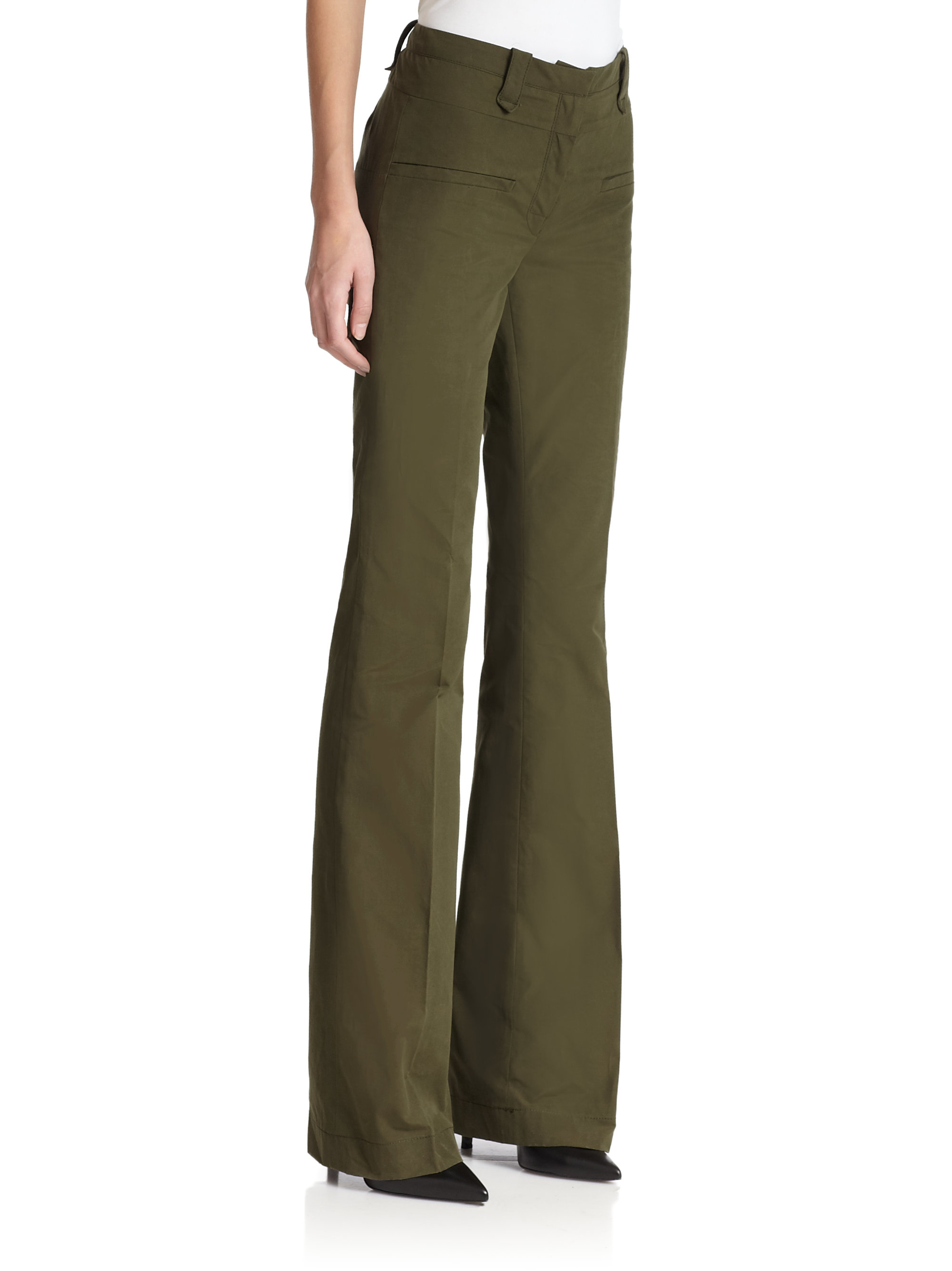 flared green trousers