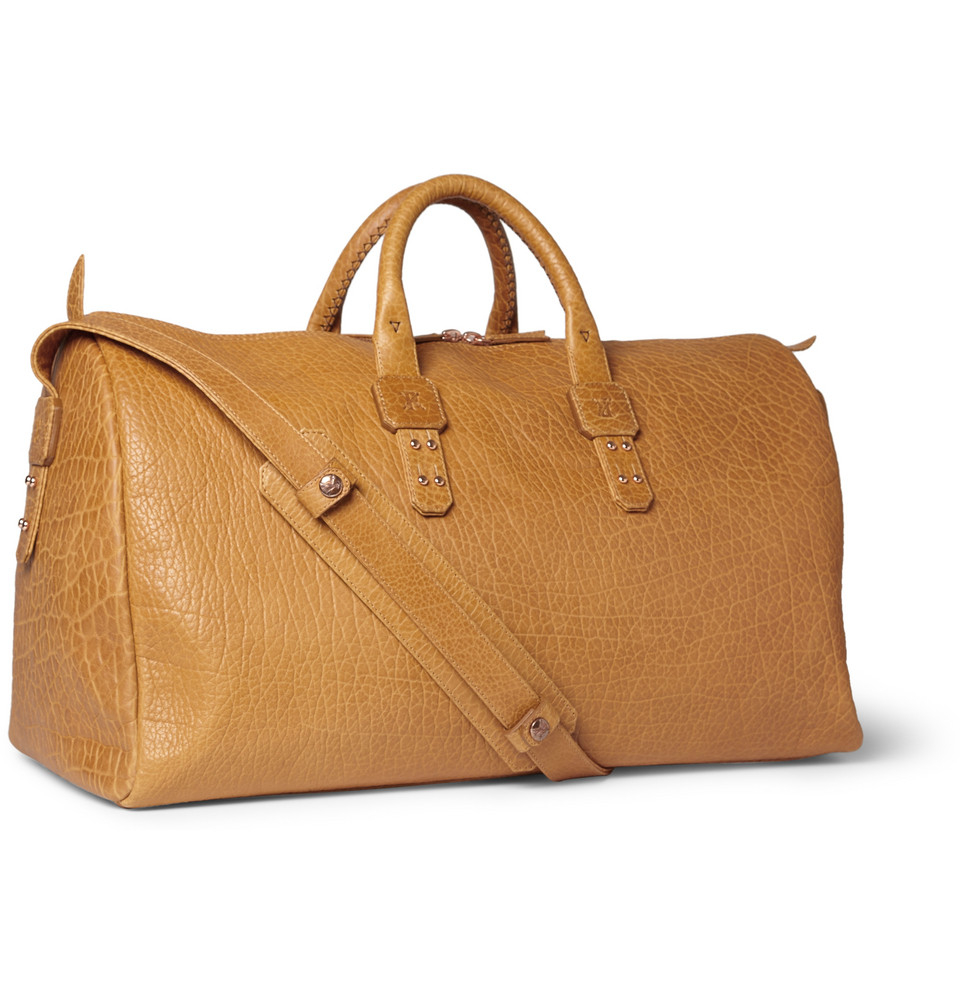 brown leather holdall bag