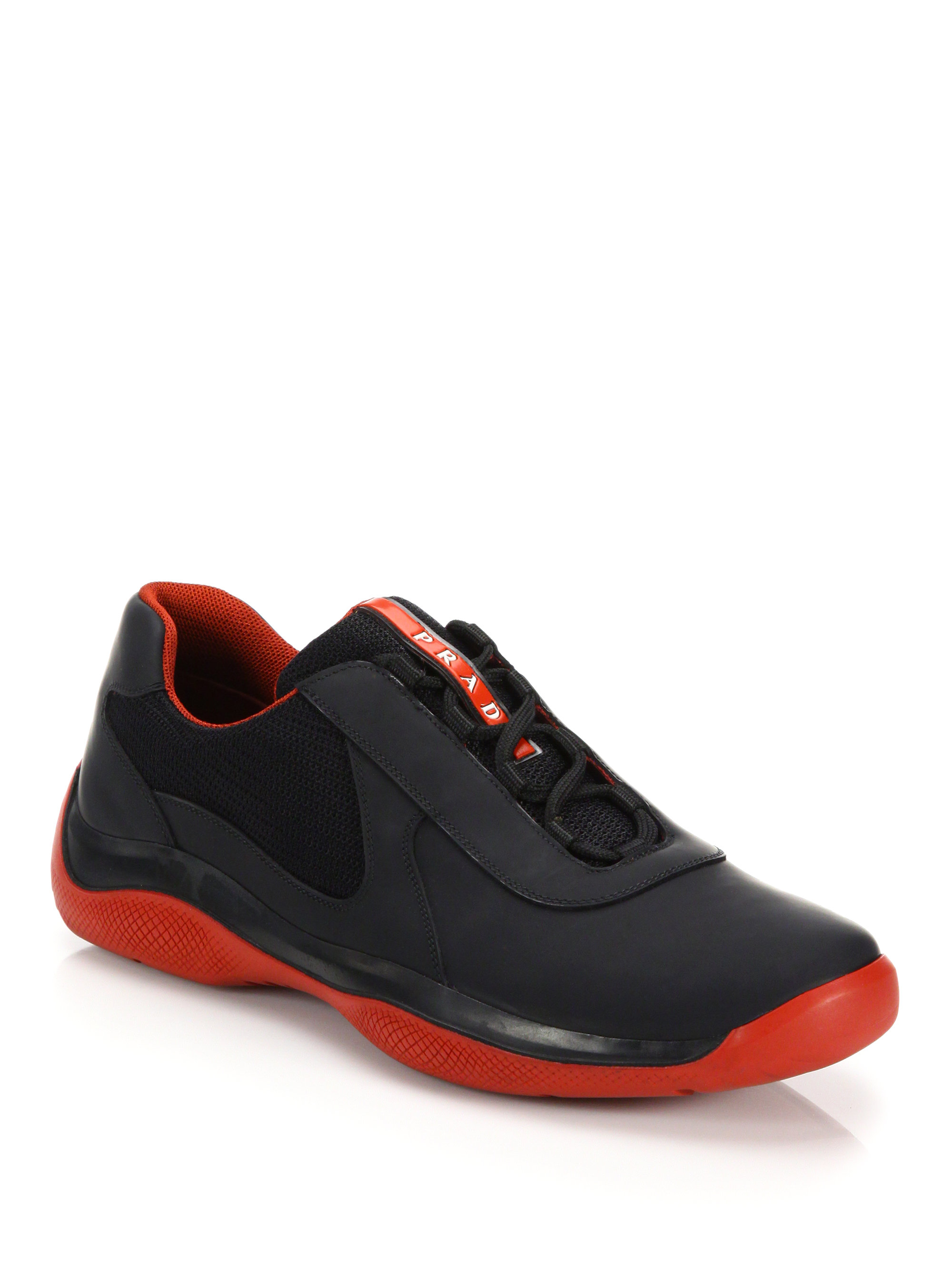 prada trainers black and red