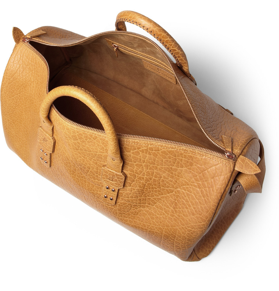 brown leather holdall bag