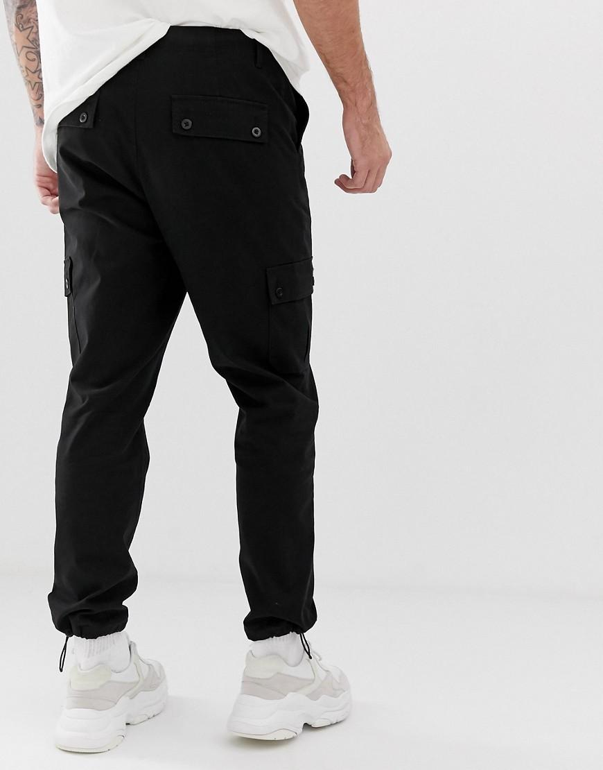 ASOS Tapered Cargo Pants In Black With toggles in Black for Men - Lyst