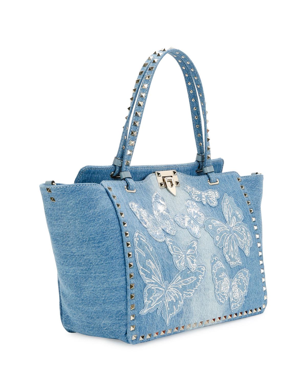 Lyst - Valentino Rockstud Medium Butterfly Washed Denim ...