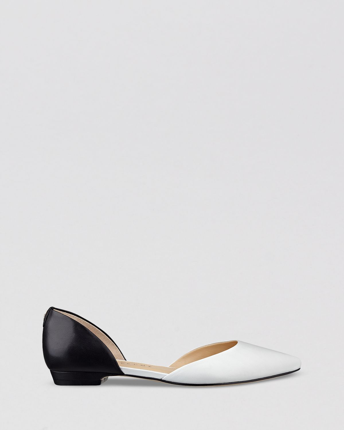 white pointy flats