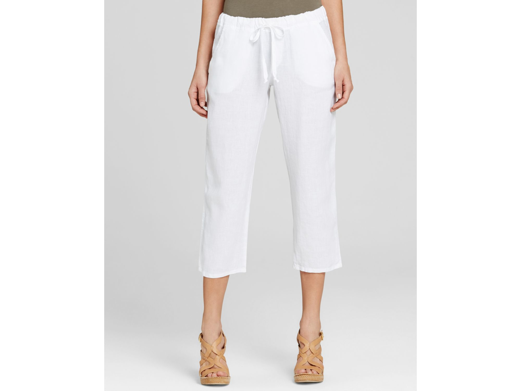 Woman in white linen capris