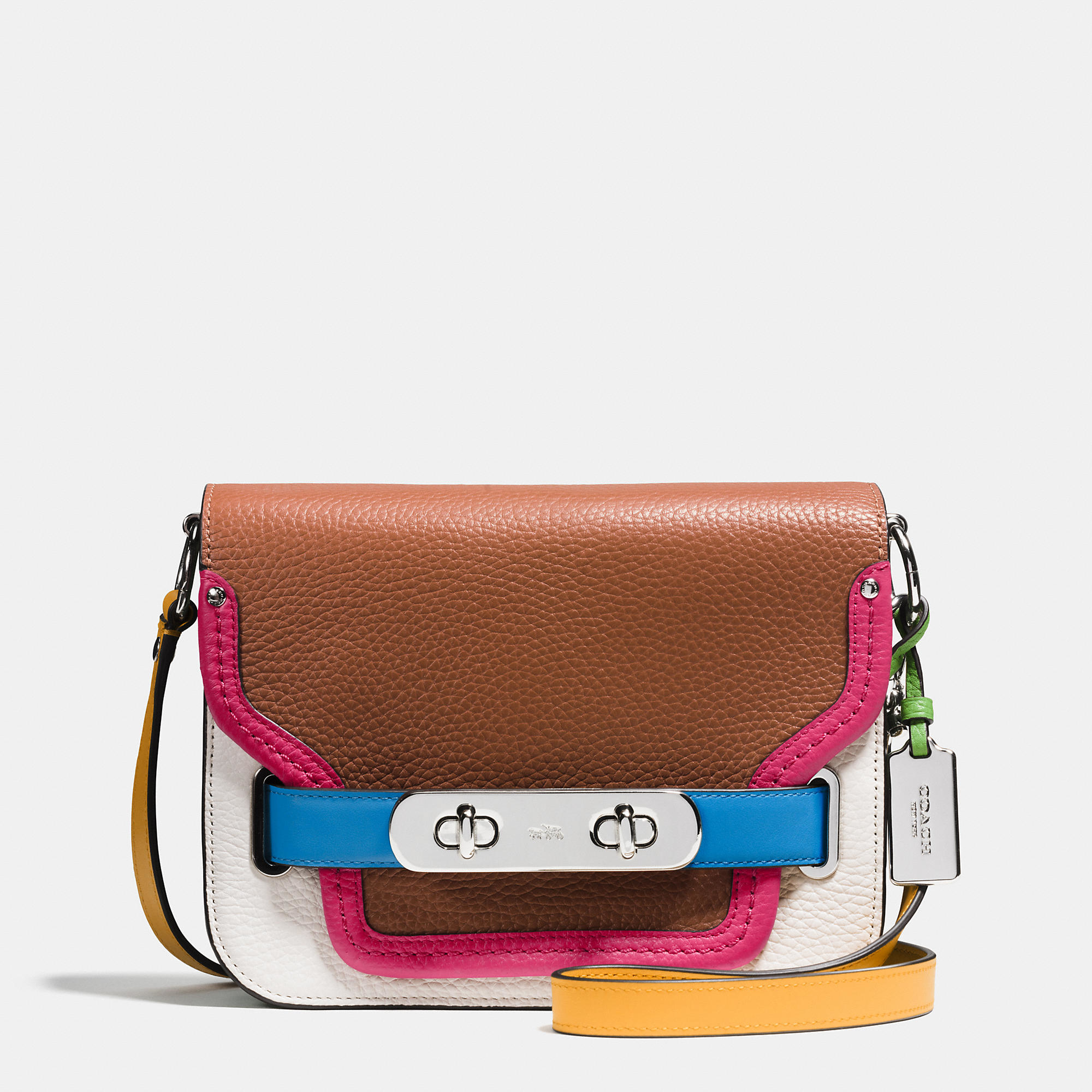 white coach purse with rainbow strap