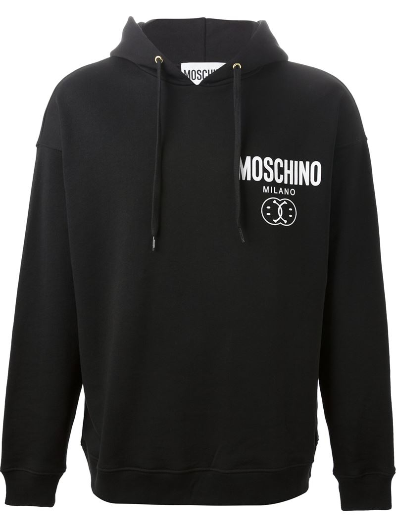 black hoodie with smiley faces