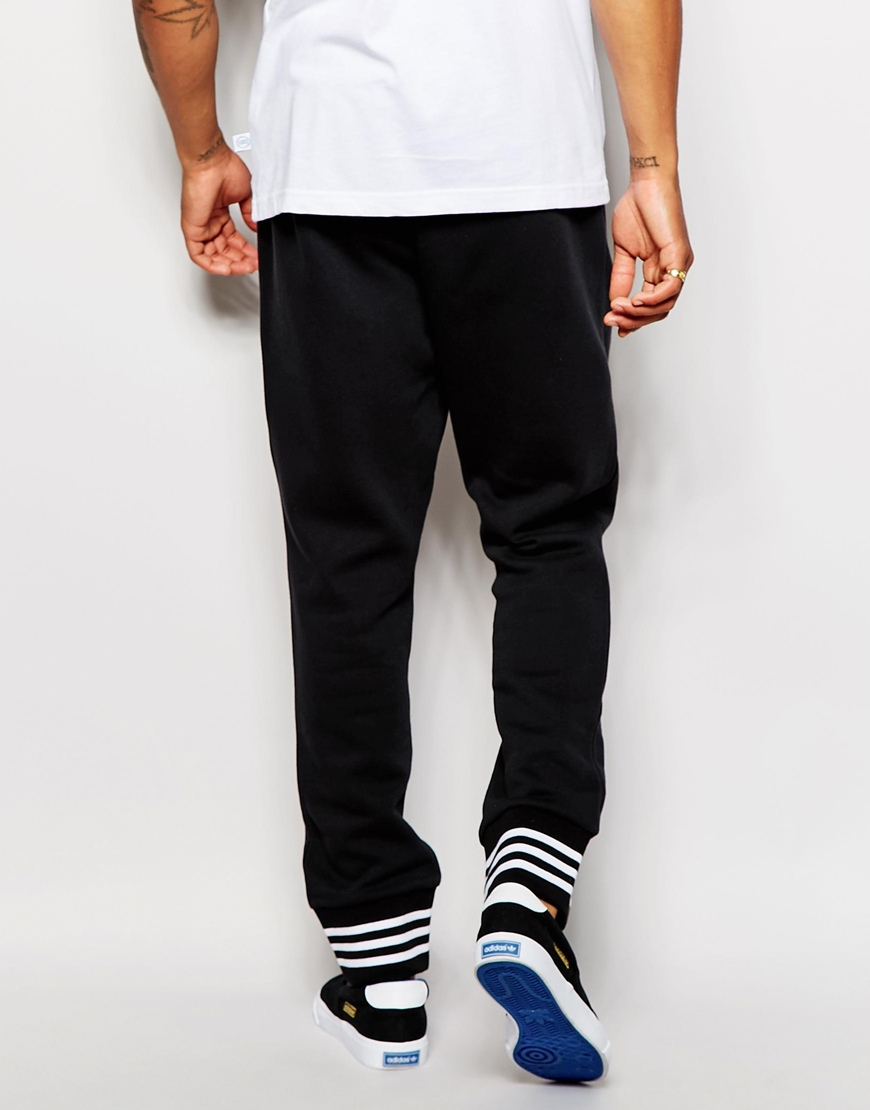 Lyst - Adidas Originals Drop Crotch Joggers With Varsity Cuff in Black ...