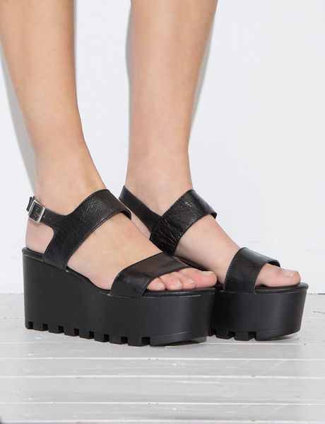 https://cdnd.lystit.com/photos/ebdf-2015/02/12/pixie-market-black-black-lug-sole-platform-sandals-product-1-27818613-0-245866761-normal_large_flex.jpeg
