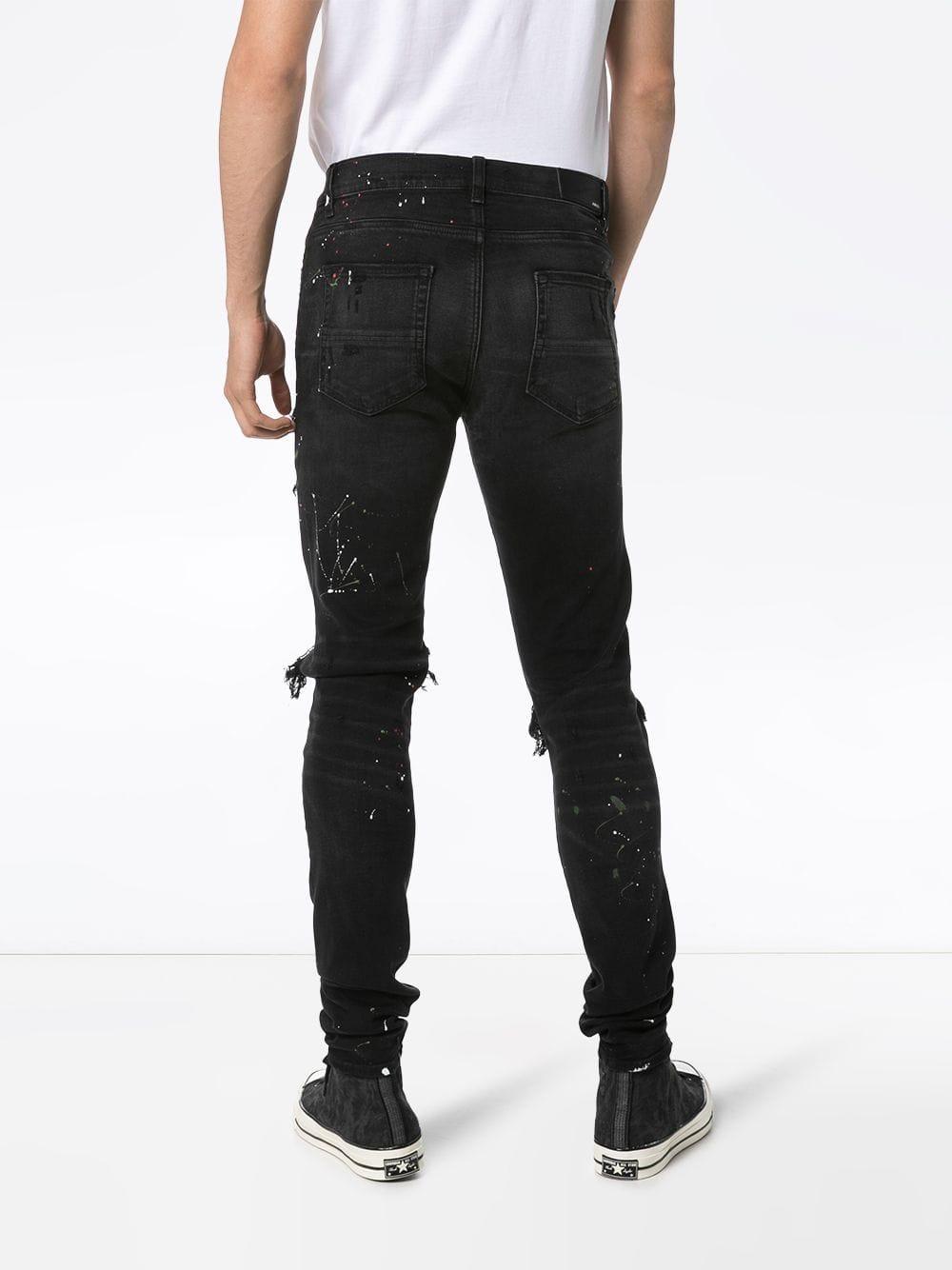 Amiri Distressed Patch-embroidered Jeans in Black for Men - Lyst