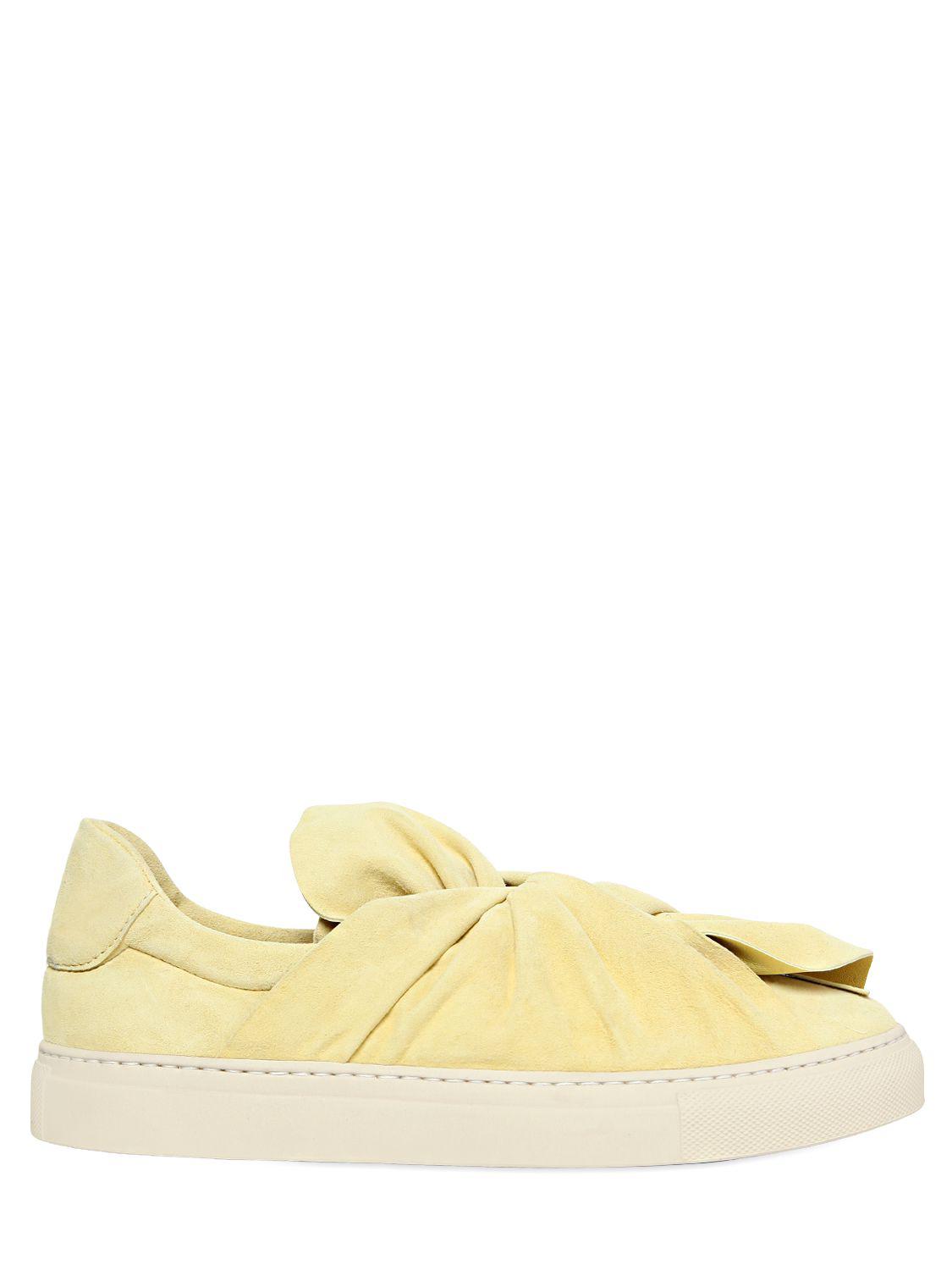 yellow slip on trainers