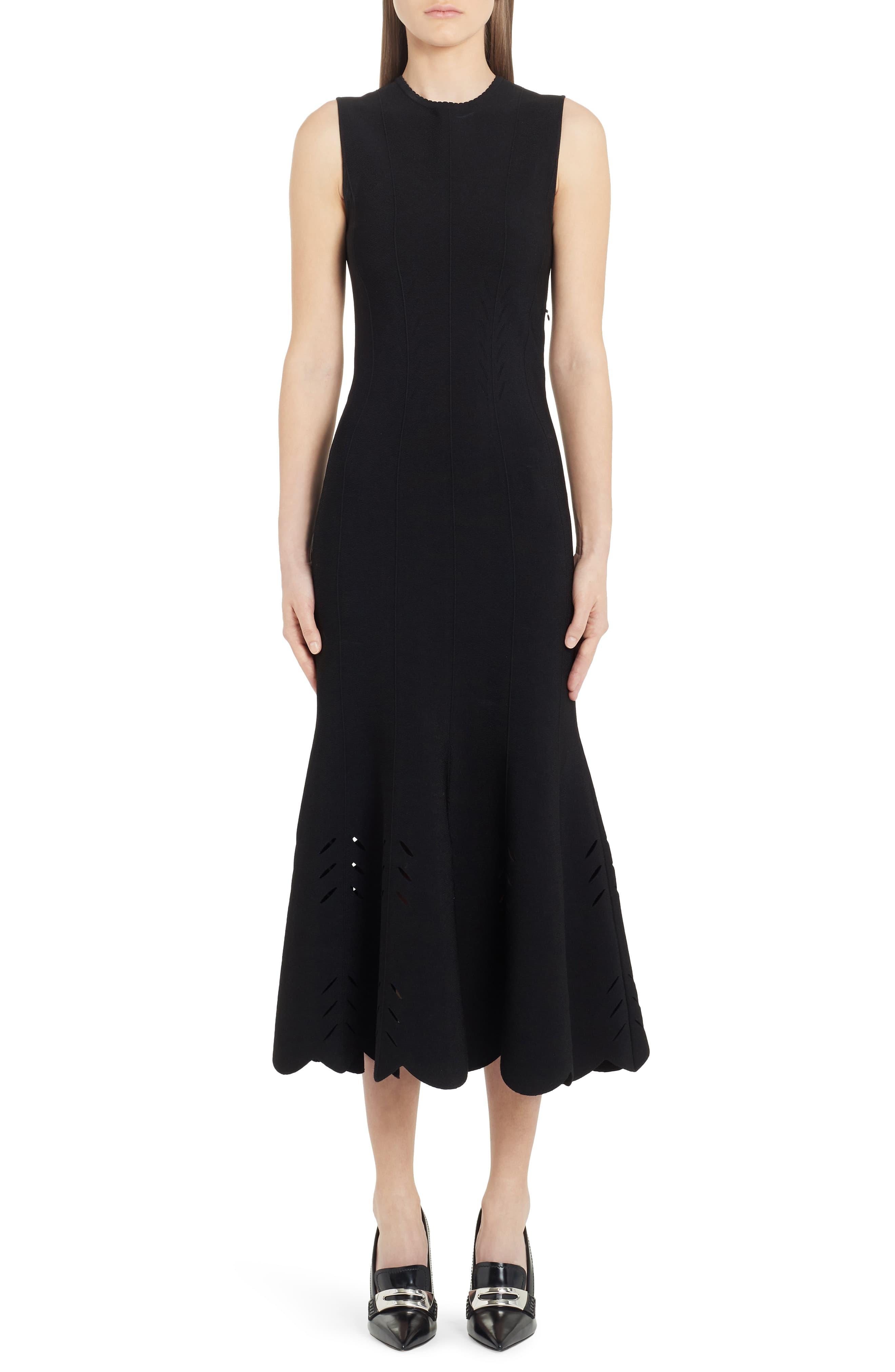 black dress with scalloped hem