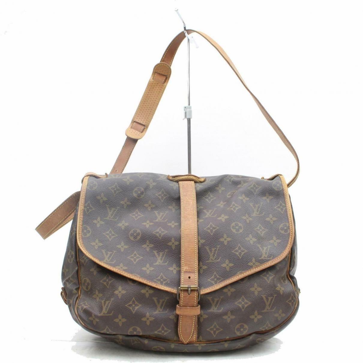 Louis Vuitton Pre-owned Saumur Brown Leather Handbags in Brown - Lyst